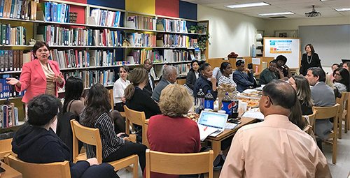 Faculty in auditorium lecture