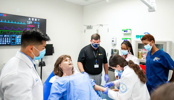 Students and instructors working in medical lab