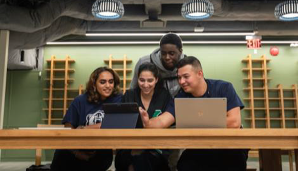 Students looking at computer in Salten Hall