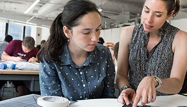 Woman and student reading text