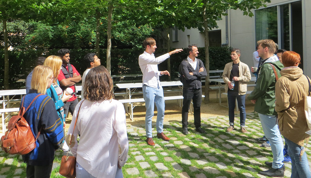 NYIT students pose in front of the Bauhaus.