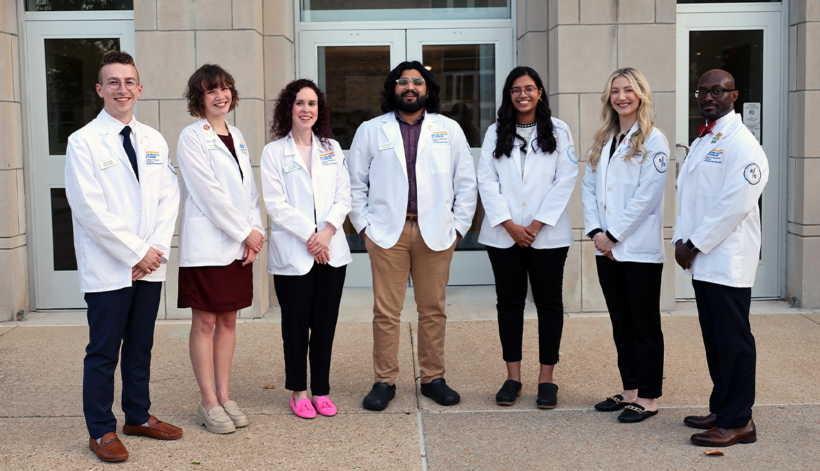 NYITCOM-Arkansas students in front of a building