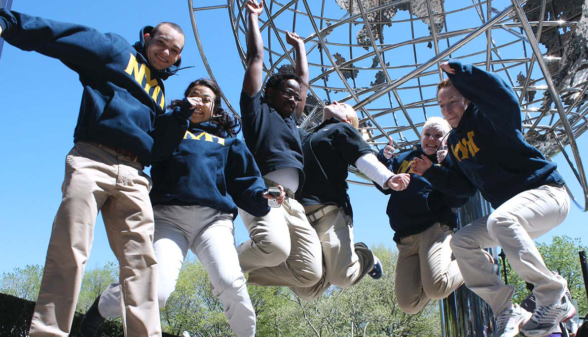 Students jumping near NYIT Students jumping near NYIT