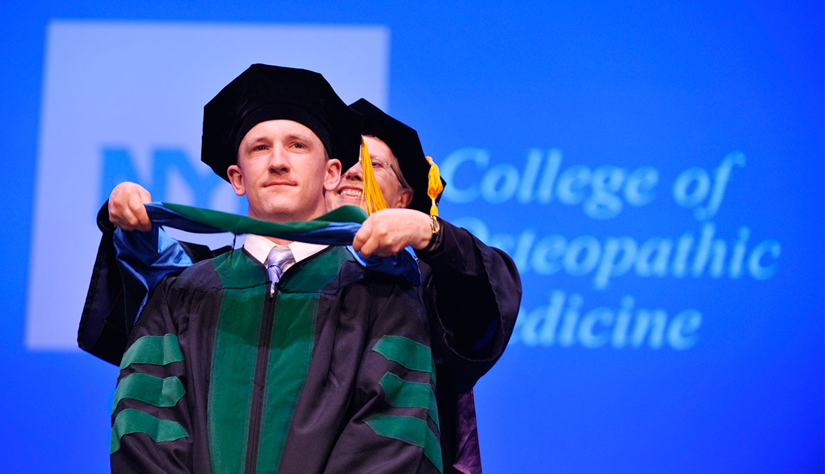 NYITCOM graduate receives doctoral hood