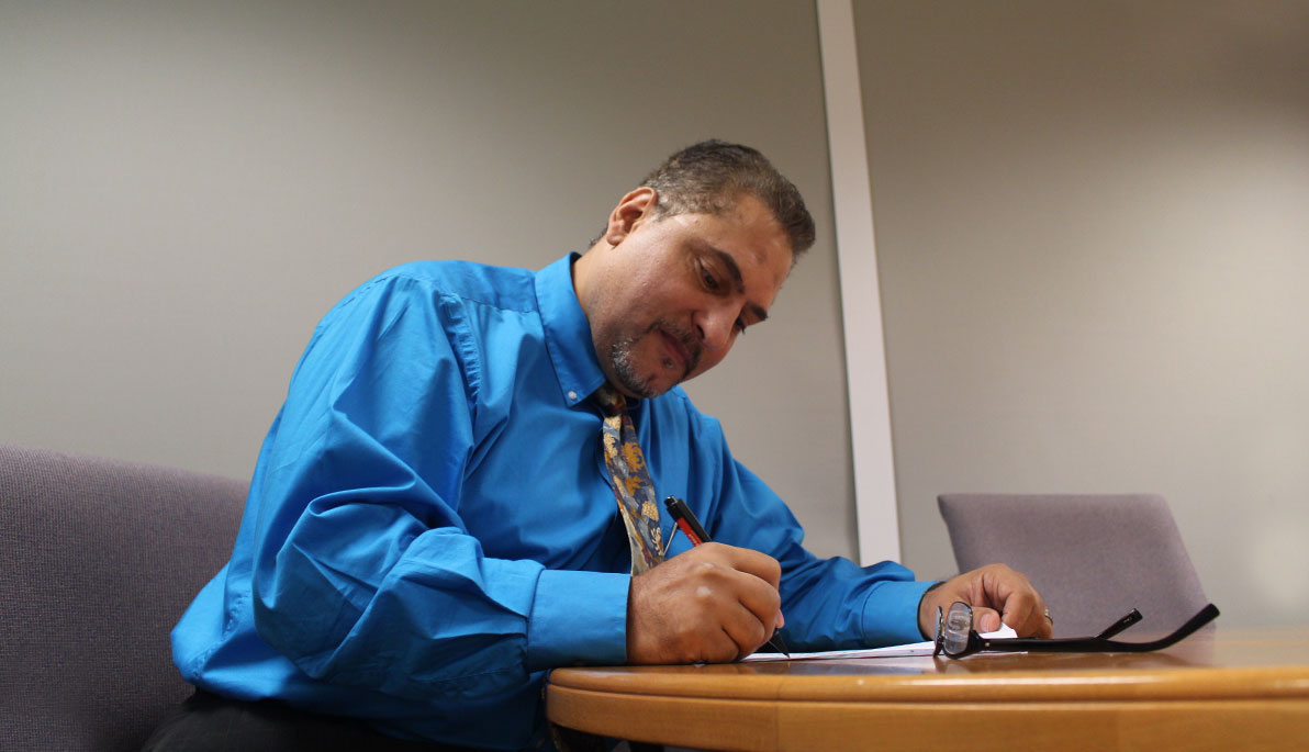 NYIT School of Management faculty member Amr Swid, Ph.D., in his office on the NYIT campus.