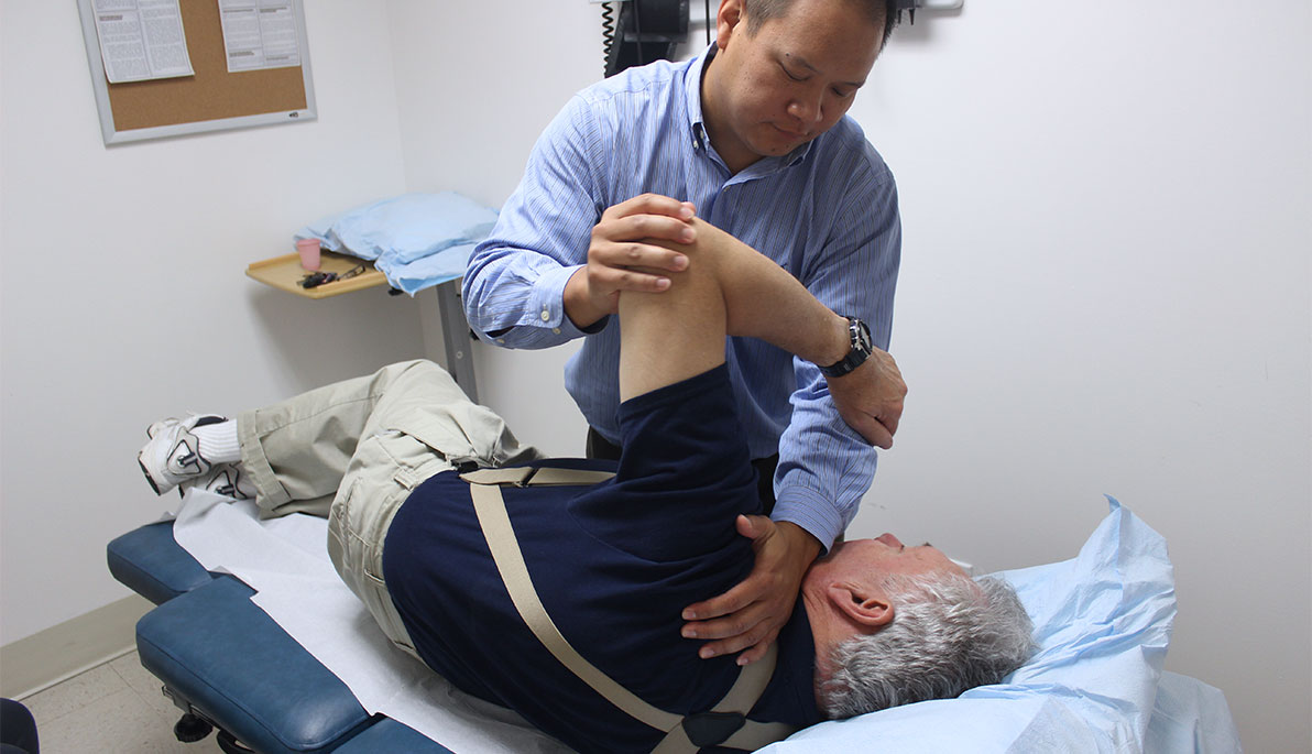 Associate Professor Sheldon Yao with patient Associate Professor Sheldon Yao with patient
