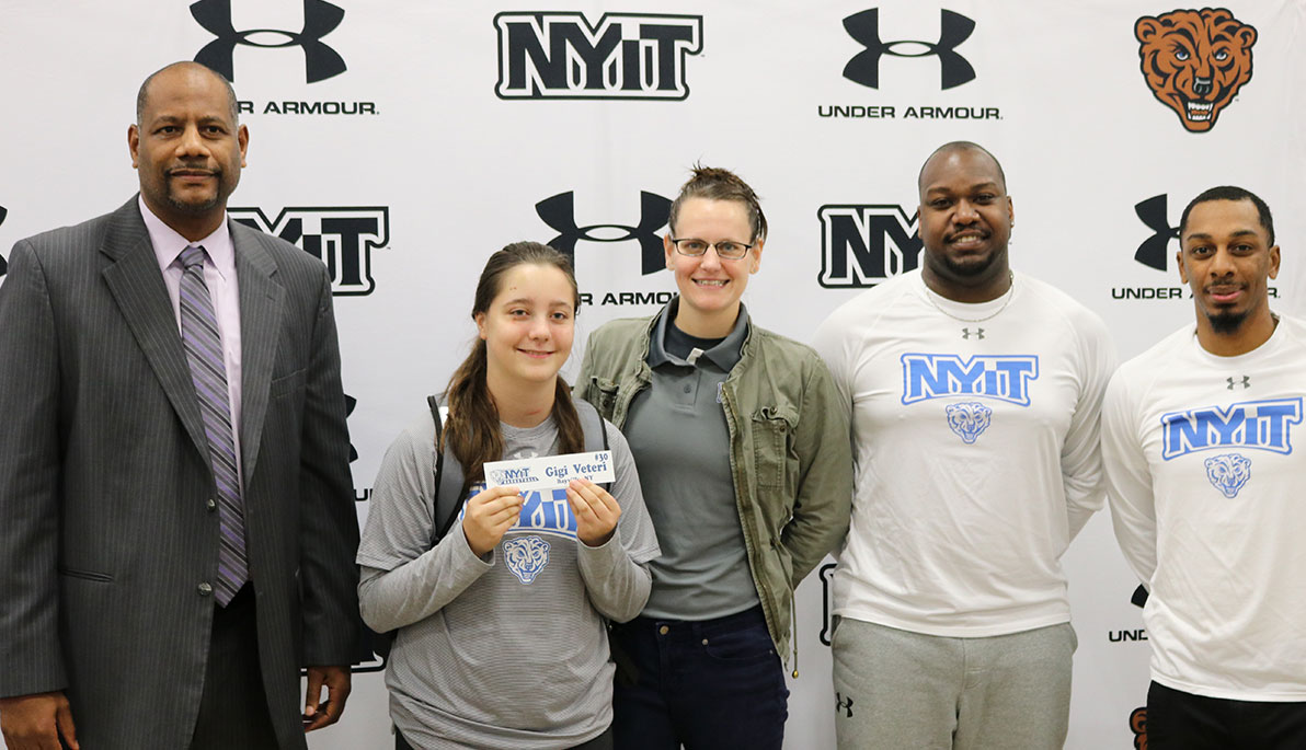 Head Coach Ken Parham with Gigi Veteri, and Assistant Coaches Dana Carney, Robe Isme and Bryant Lassiter.