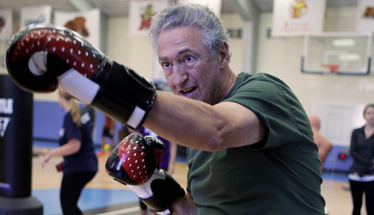 Man boxing at Rock Steady Boxing NYIT