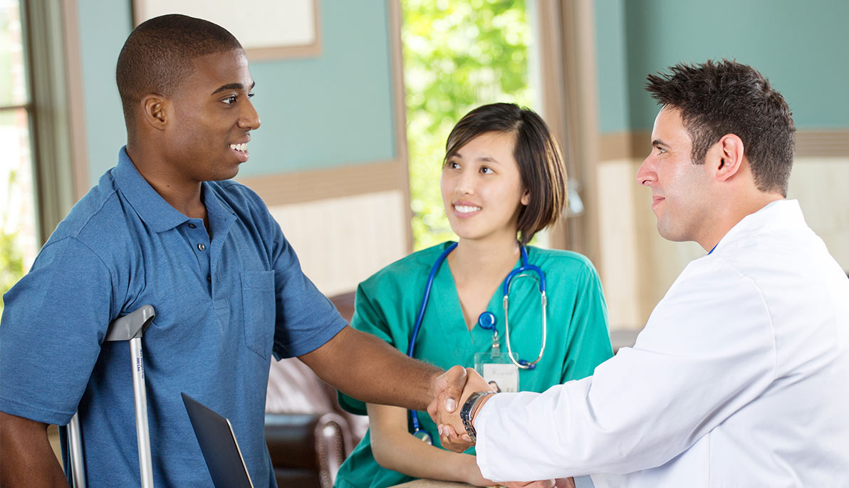 Racially diverse patient and doctor.