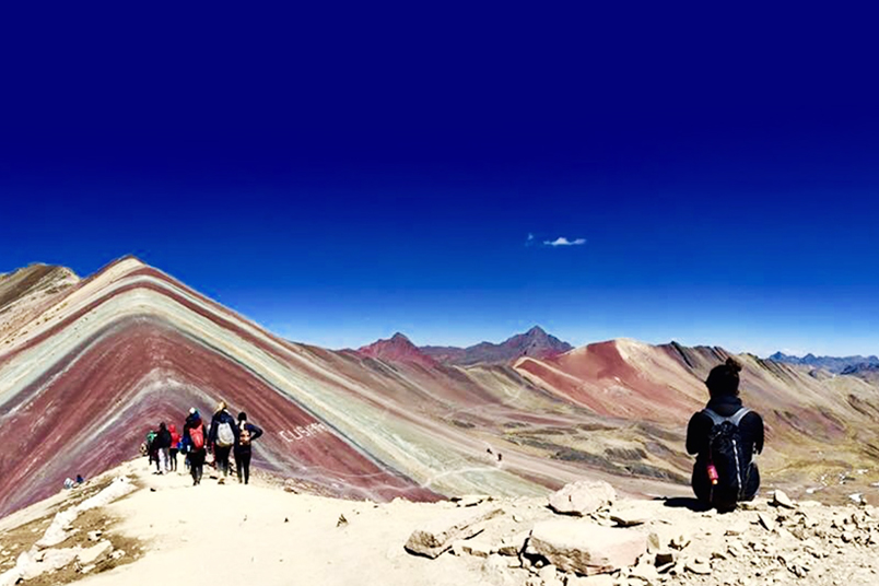 People hiking in the Andres Mountains.