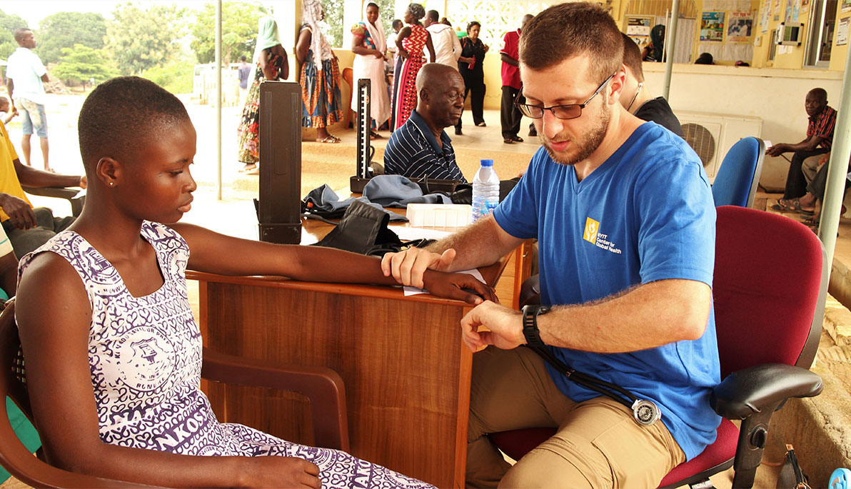 NYITCOM checking a patient