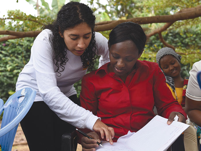 May Sefin and Beatrice Temba discuss business plan development at the Excel Education Foundation in Moshi, Tanzania.