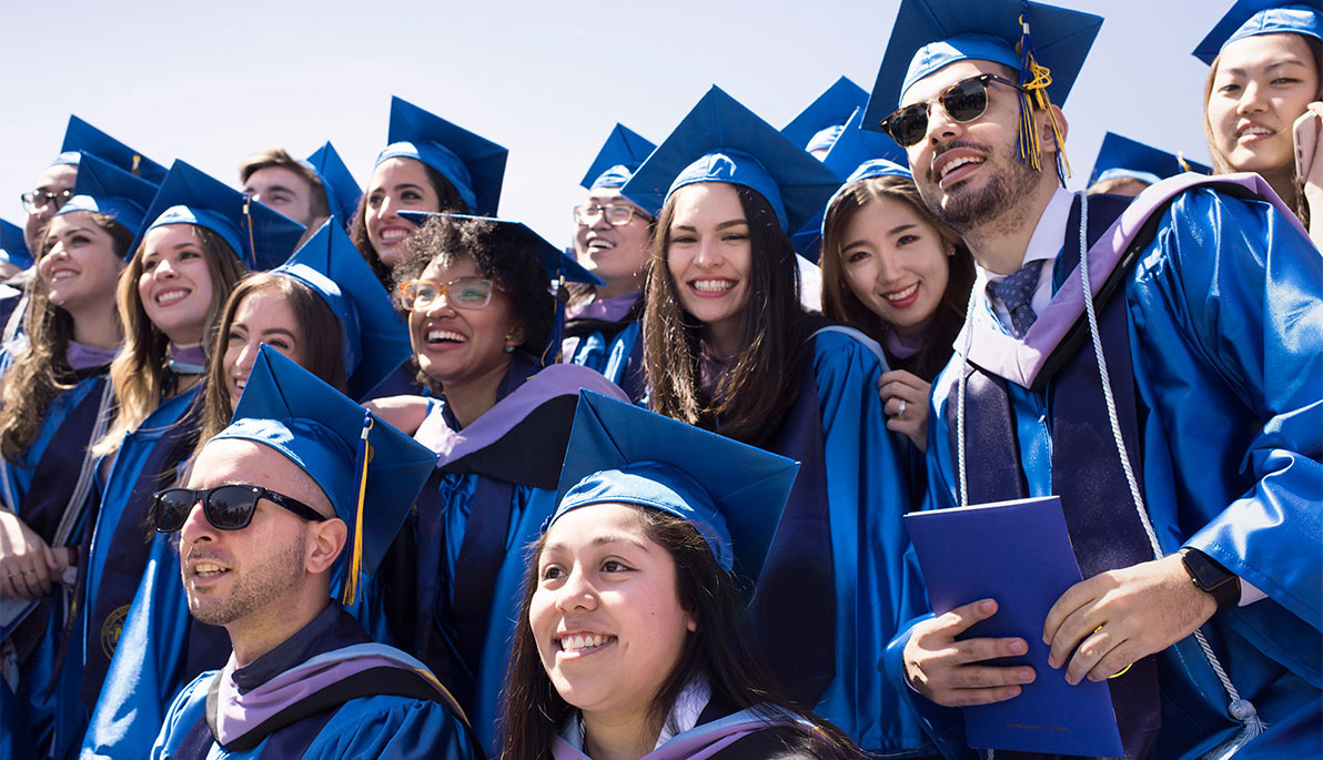 Students in caps and gowns. Students in caps and gowns.
