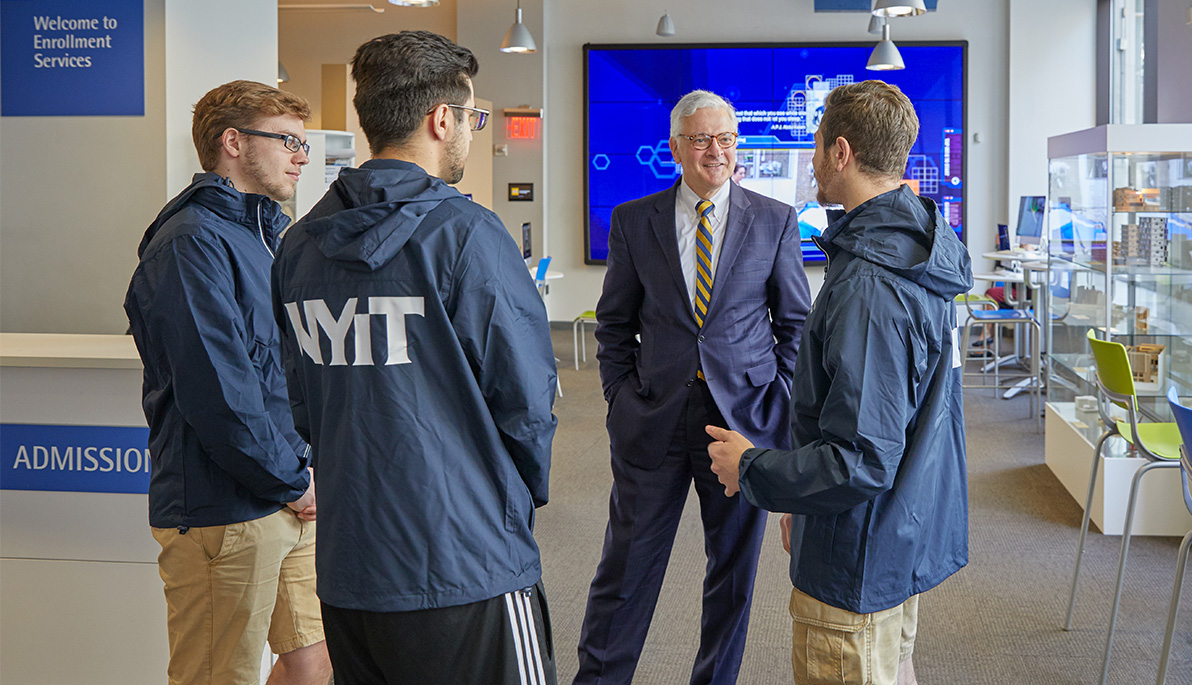 NYIT President Hank Foley with students. NYIT President Hank Foley with students.