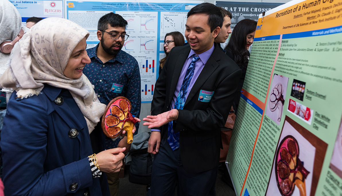 Attendees looking at poster presentations