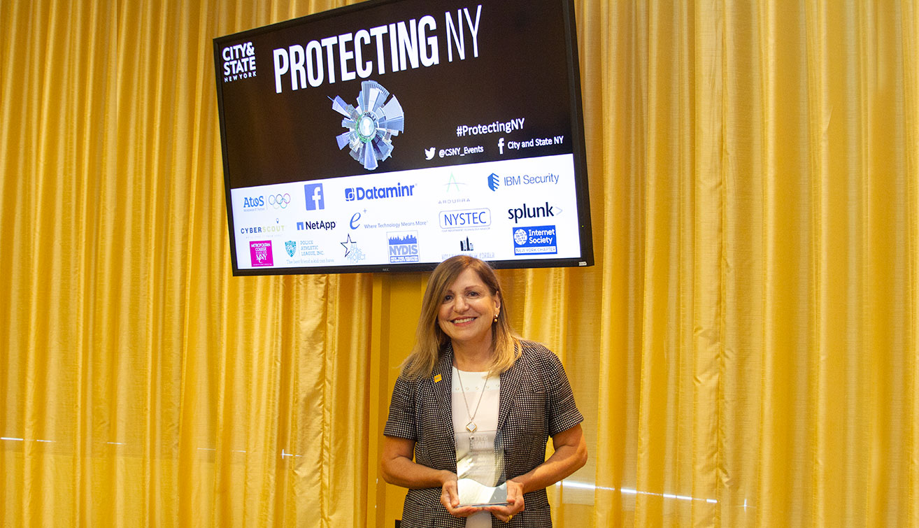 Nada Anid holding award