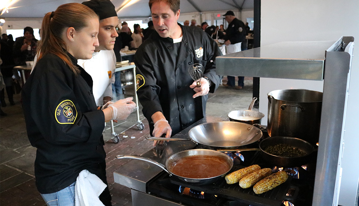 Police officers at their cooking station. Police officers at their cooking station.