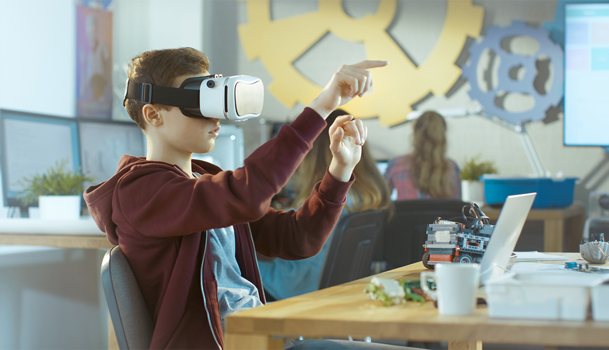 A middle school student wearing a VR headset.