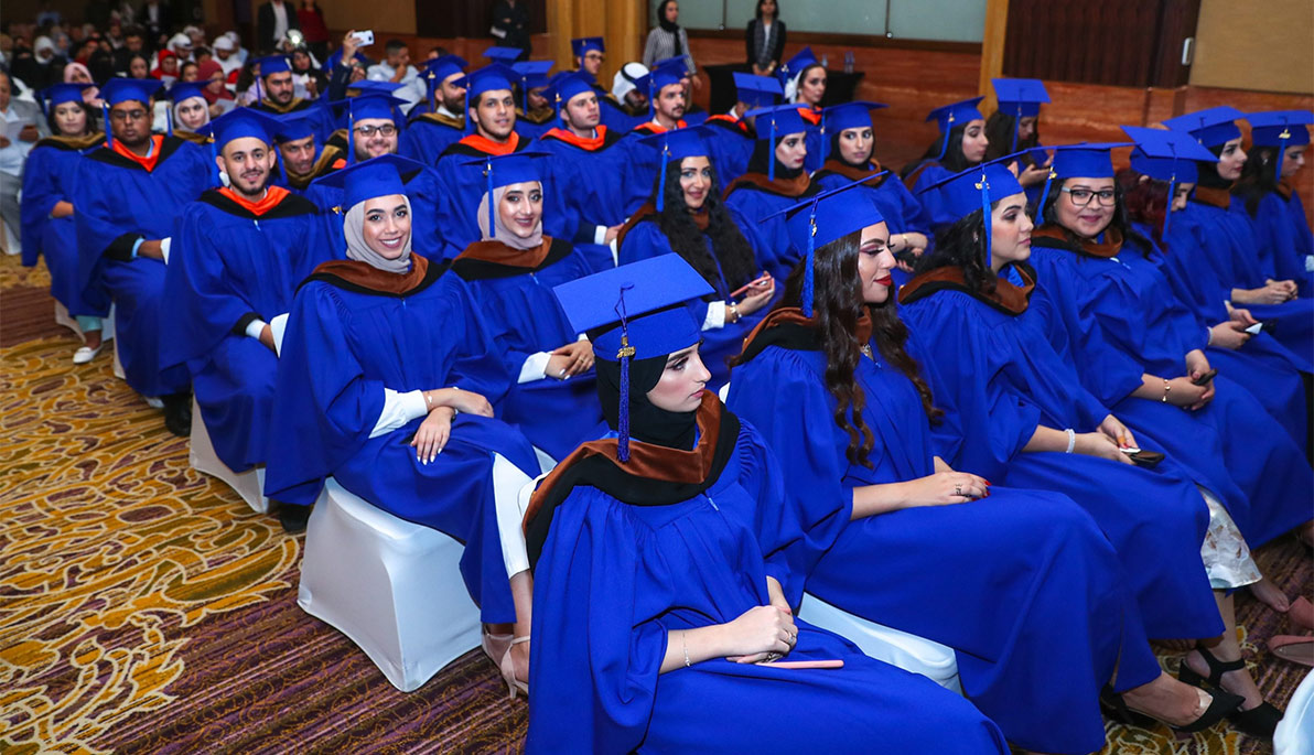 Graduates assembled in caps and gowns