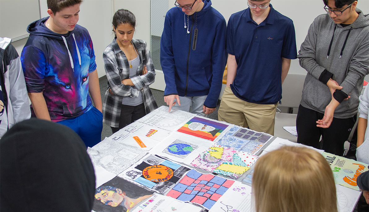 New York Tech students looking at the quilt. New York Tech students looking at the quilt.