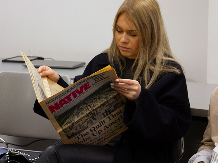 StudentReadingNewspaper_Inline."