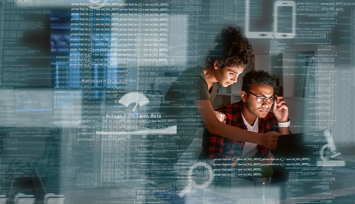 Woman and man looking at computer screen