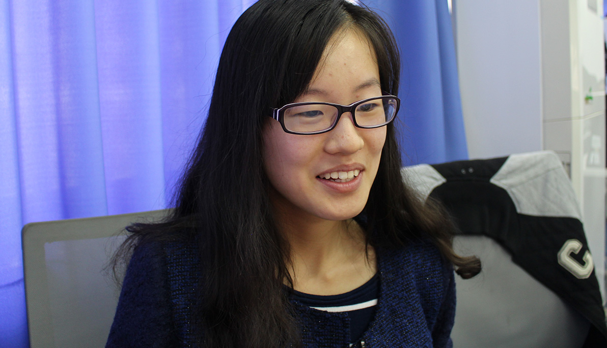 Student sitting at an interview. 