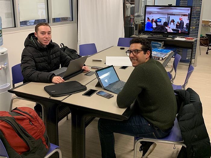 Atrachji and Doxey work together at lab table