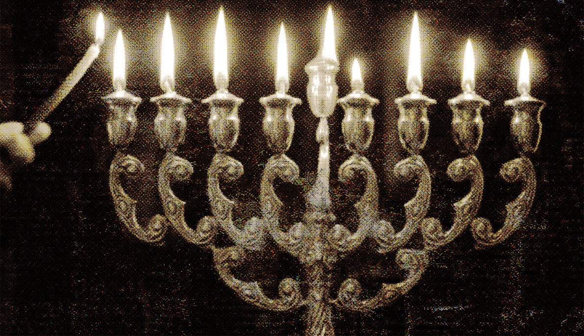 Someone lighting a menorah.