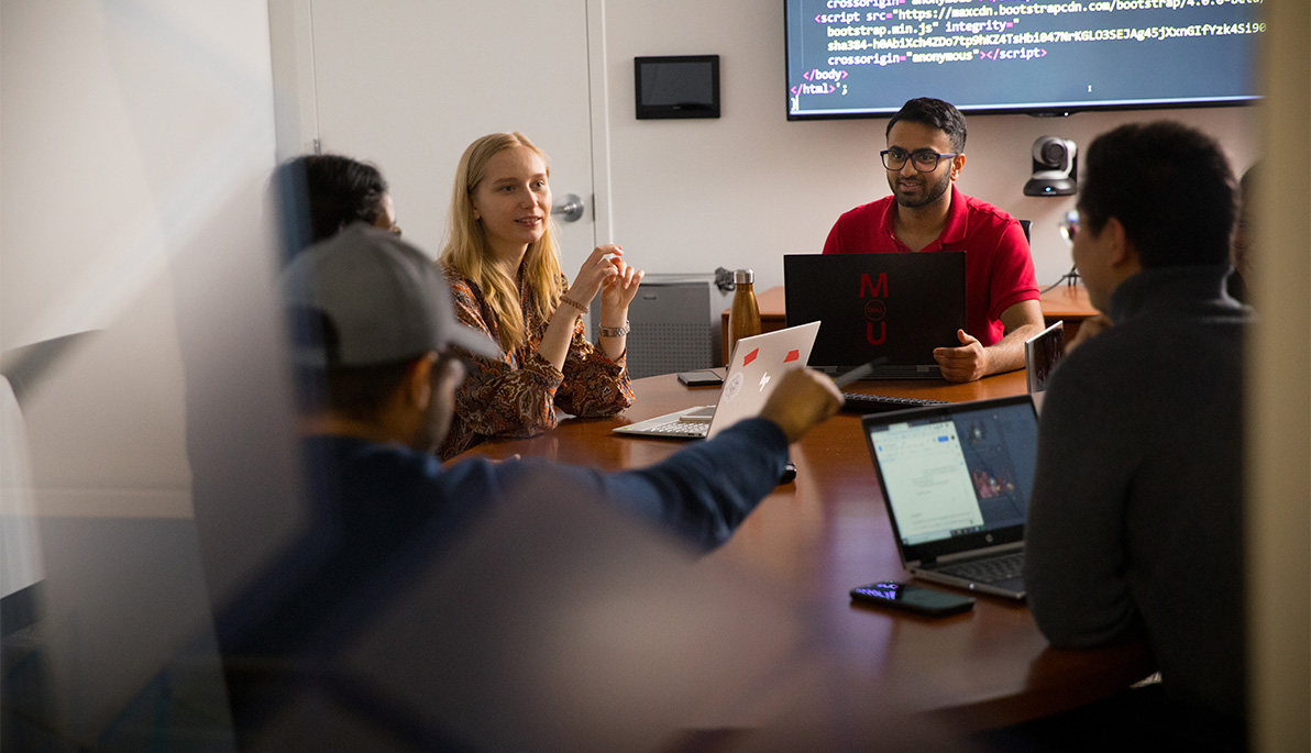 New York Tech students sitting in a classroom.