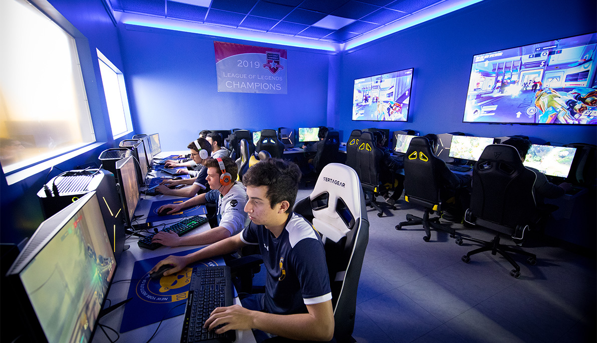 New York Tech esports players sitting at stations playing