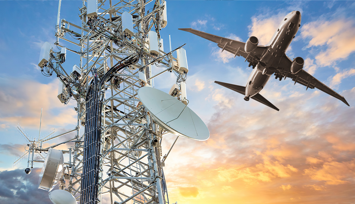 Airplane flying past cell tower