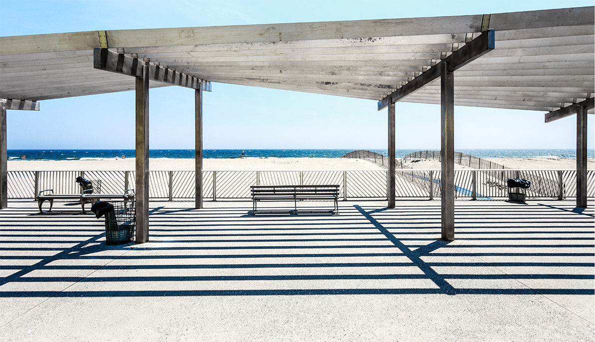 View of beach from covered boardwalk