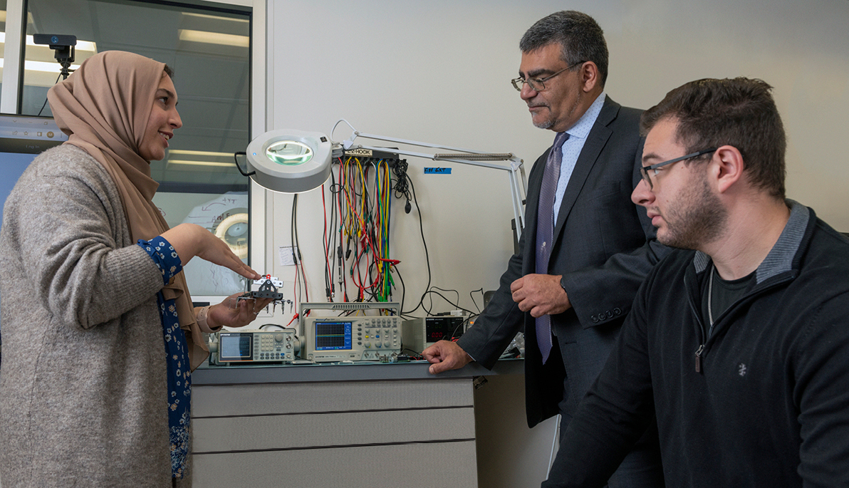 Students Anila Khan and Alexander Impastato with Dean Babak Beheshti in the ETIC on the Long Island campus