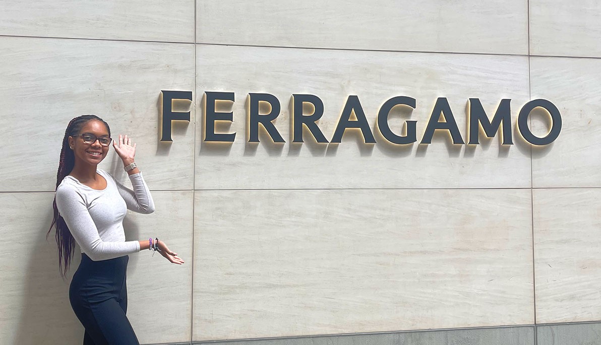 Pashence Glover next to a Ferragamo sign