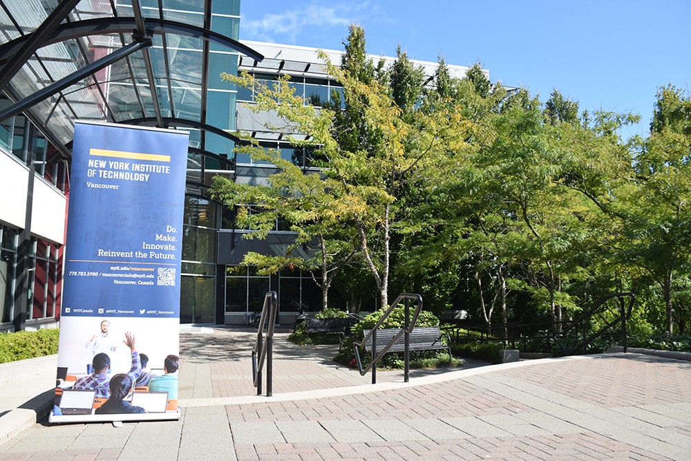 students walking on the campus grounds