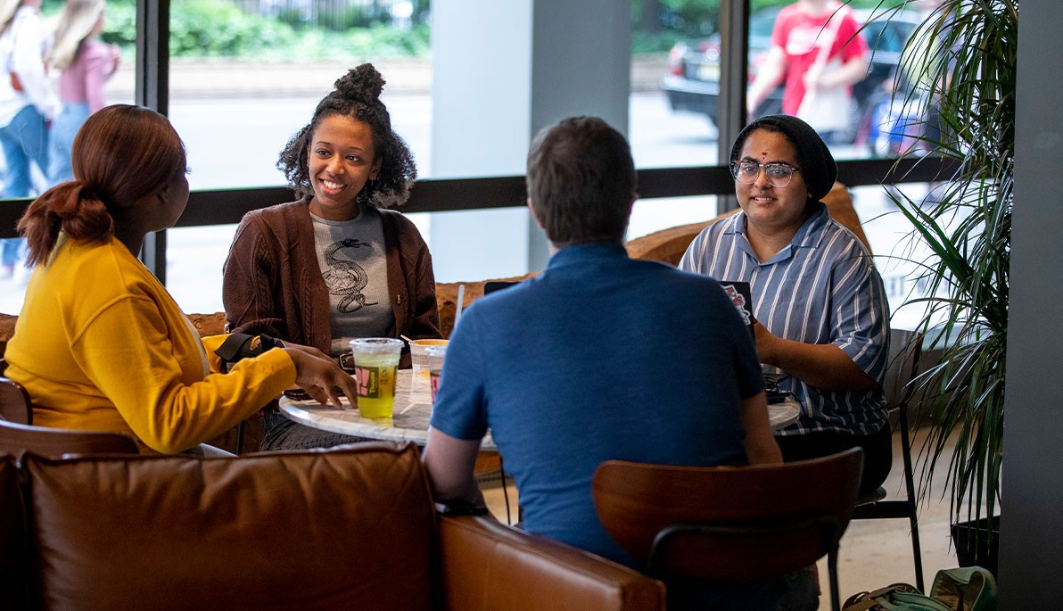 New York Tech students sitting at a table