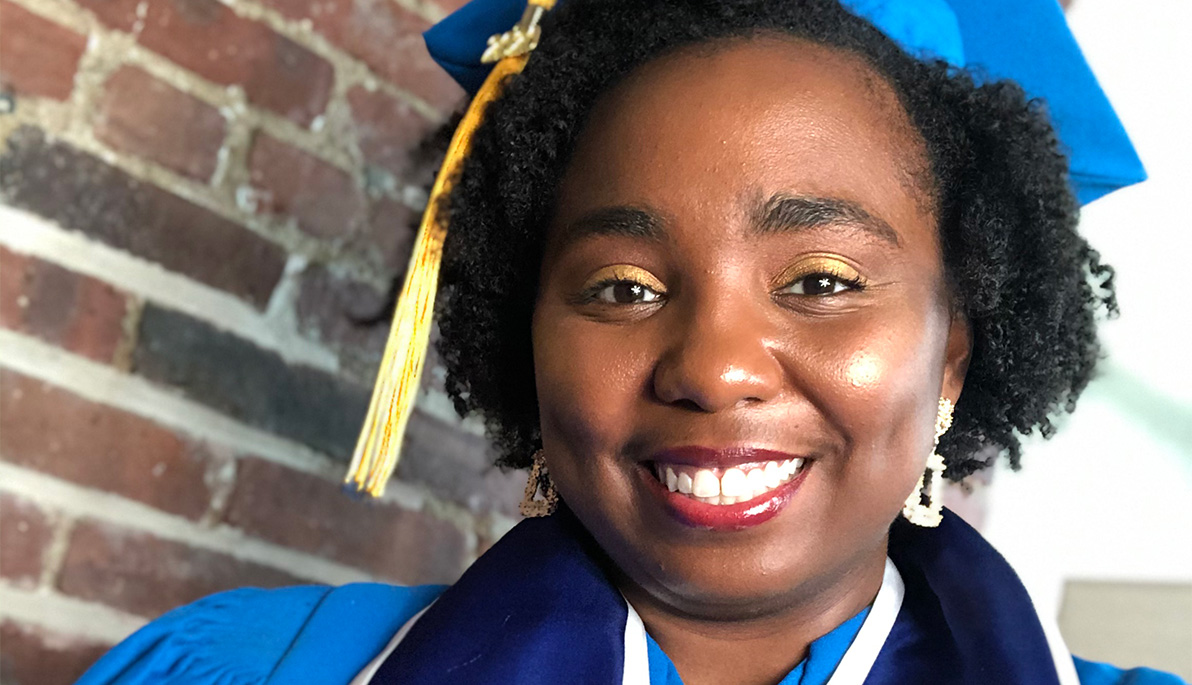 Close-up photo of Ashley Dent in cap and gown.