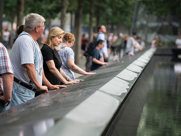 Denise Berger in front of the World Trade Center Memorial