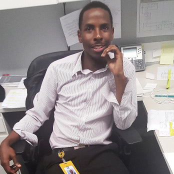 Steavian Sampson (in his office at Florida Power and Light Company)