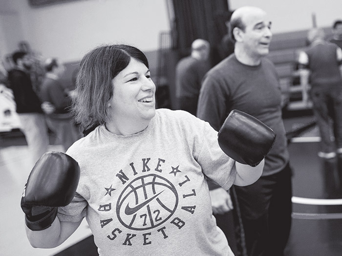 Boxer Mindi Ageloff-Guendel works out with Burns.