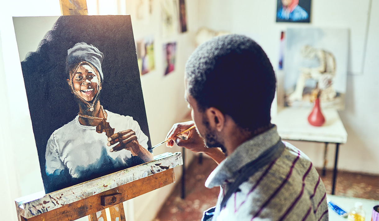 Artist painting on a canvas