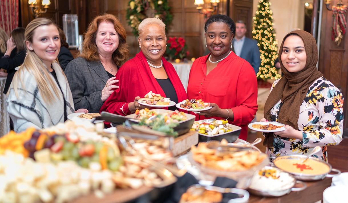 Three women at a brunch buffet