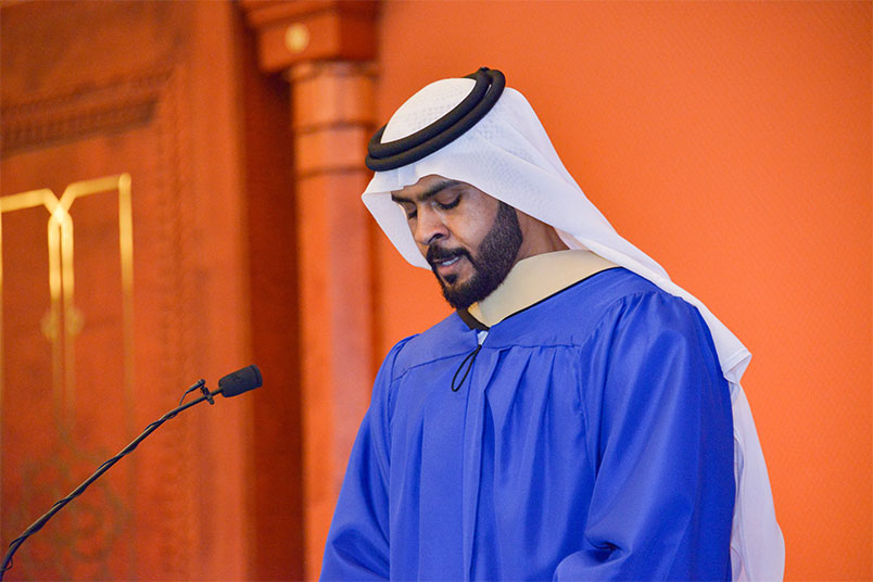 Graduate Mohamed Al Dhaheri recites a selection from the Qur'an.