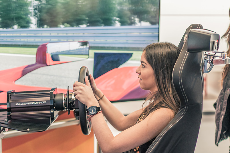 Experiencing a Formula 1 race car simulator.