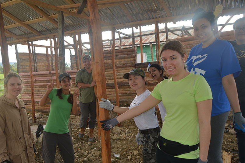 A work in progress: Some of the group members inside the unfinished house.