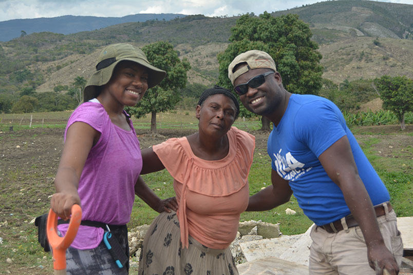 NYIT student Chanelle Sears poses with Jorge, a Bridges to Community leader, and a local woman.