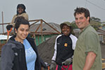 Miranda VanOmmeran (rear), and NYIT students Melissa Mahadeo and Chanelle Sears, with community youth center volunteer, Dan, preparing to shovel gravel into wheelbarrows.