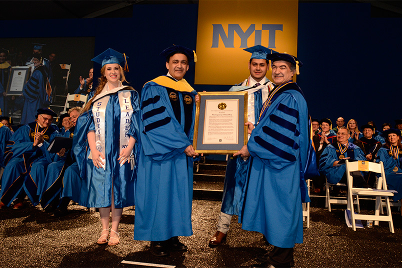 Honorary degree recipient, Humayun J. Chaudhry (D.O. ’91), with Interim President Shoureshi and student marshals, Erica Brandt and Raiyan Islam.