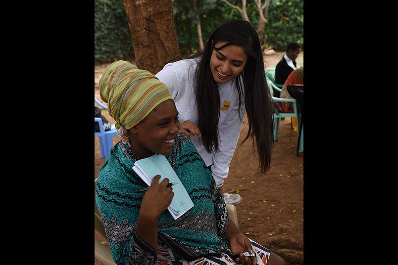 Loveness, one of the women in the group, and Ramendeep Kaur share a special moment.